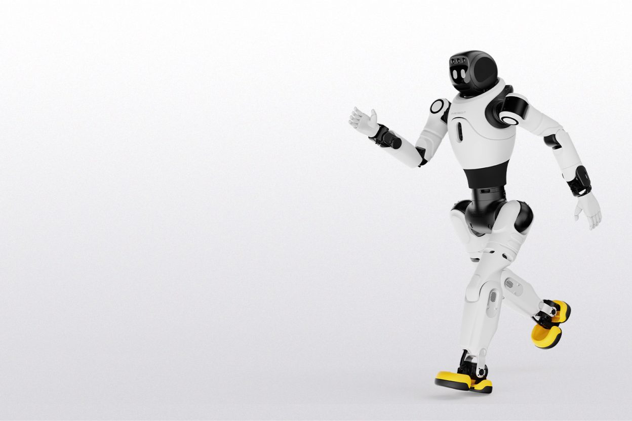 AgiBot X2 humanoid robot balancing on one foot with one hand raised, on a white background